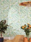Wallpaper installed in a room showing its full pattern, color