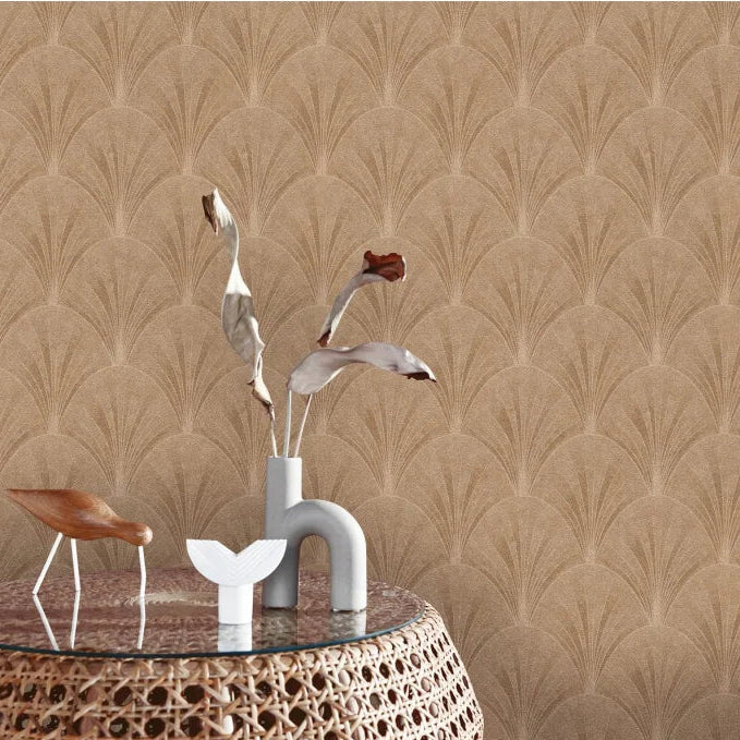 Erismann Elle Decoration subtle Art Deco fan wallpaper in beige and brown tones behind a rattan table and decor