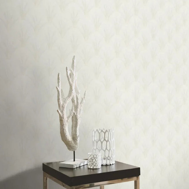 Erismann Elle Decoration light Art Deco fan wallpaper in soft white and beige tones behind a square table and center piece.