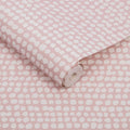 Closeup of a wallpaper showing its Contemporary, Dots, Pink pattern, color, and subtle texture.