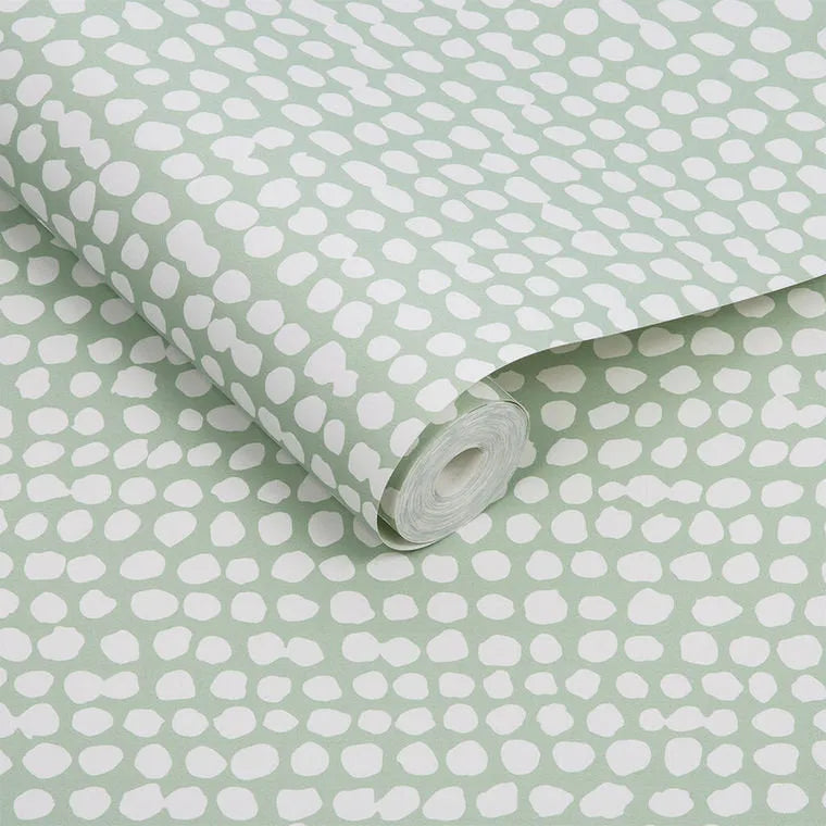 Closeup of a wallpaper showing its Contemporary, Dots, Green pattern, color, and subtle texture.