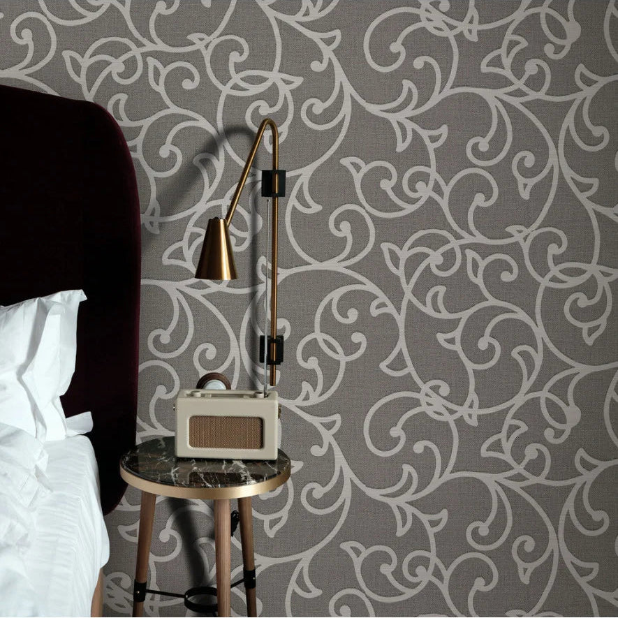 Erismann Opus 10467-11 charcoal grey wallpaper with white ornamental vine scrolls on a fabric-effect ground.