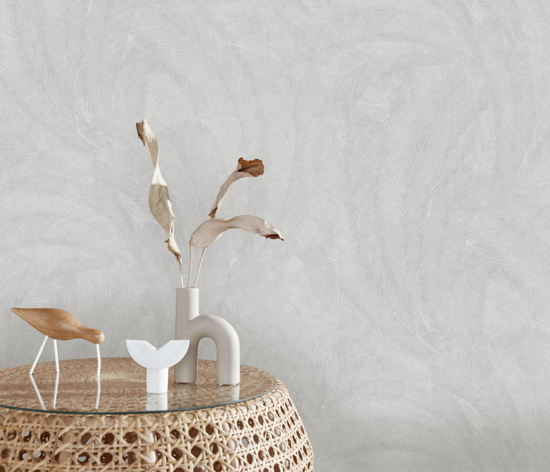 Erismann Elysium botanical wallpaper featuring delicate feather-like leaves in soft gray and white tones, enhanced by fine linear texture for a subtle, elegant and airy appearance.