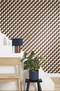 Wallpaper installed in a room showing its full pattern, color