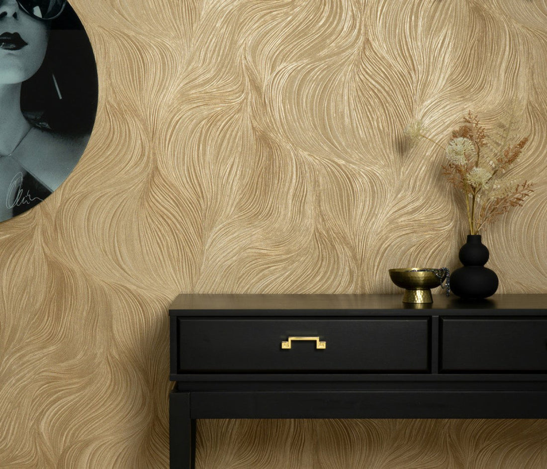 Close-up of gold wave-pattern wallpaper with fine embossed linear texture.