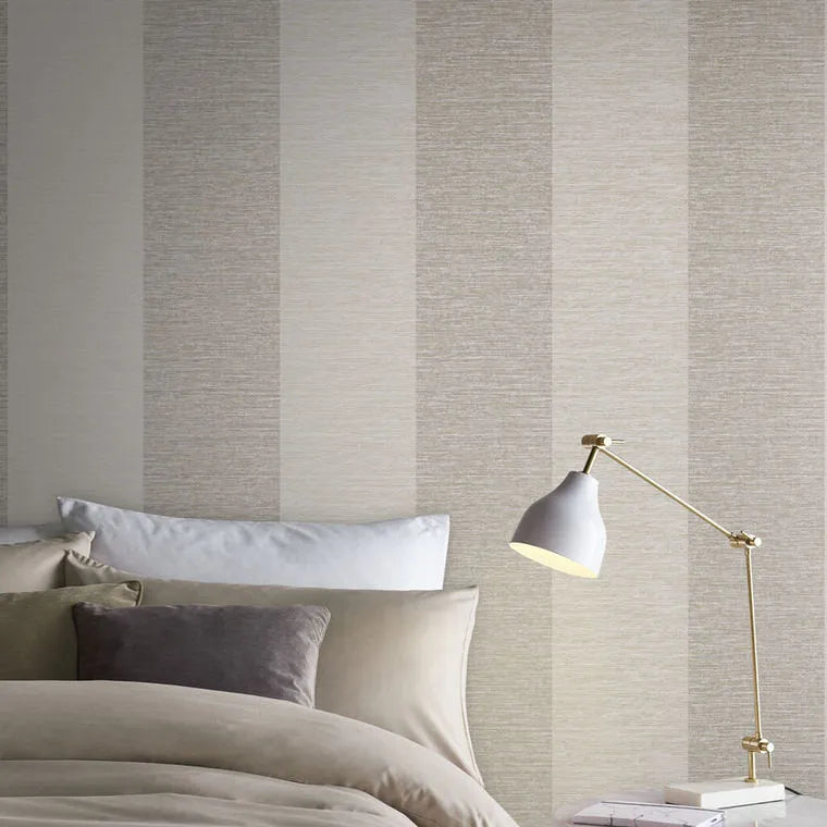 Closeup of a wallpaper showing its Contemporary, Metallic, Stripes, Taupe, Two-tone pattern, color, and subtle texture.