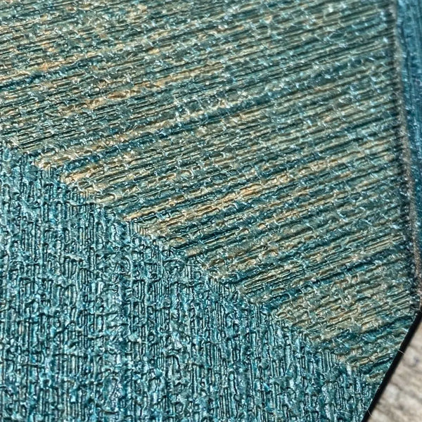 Wallpaper installed in a room showing its full pattern, color