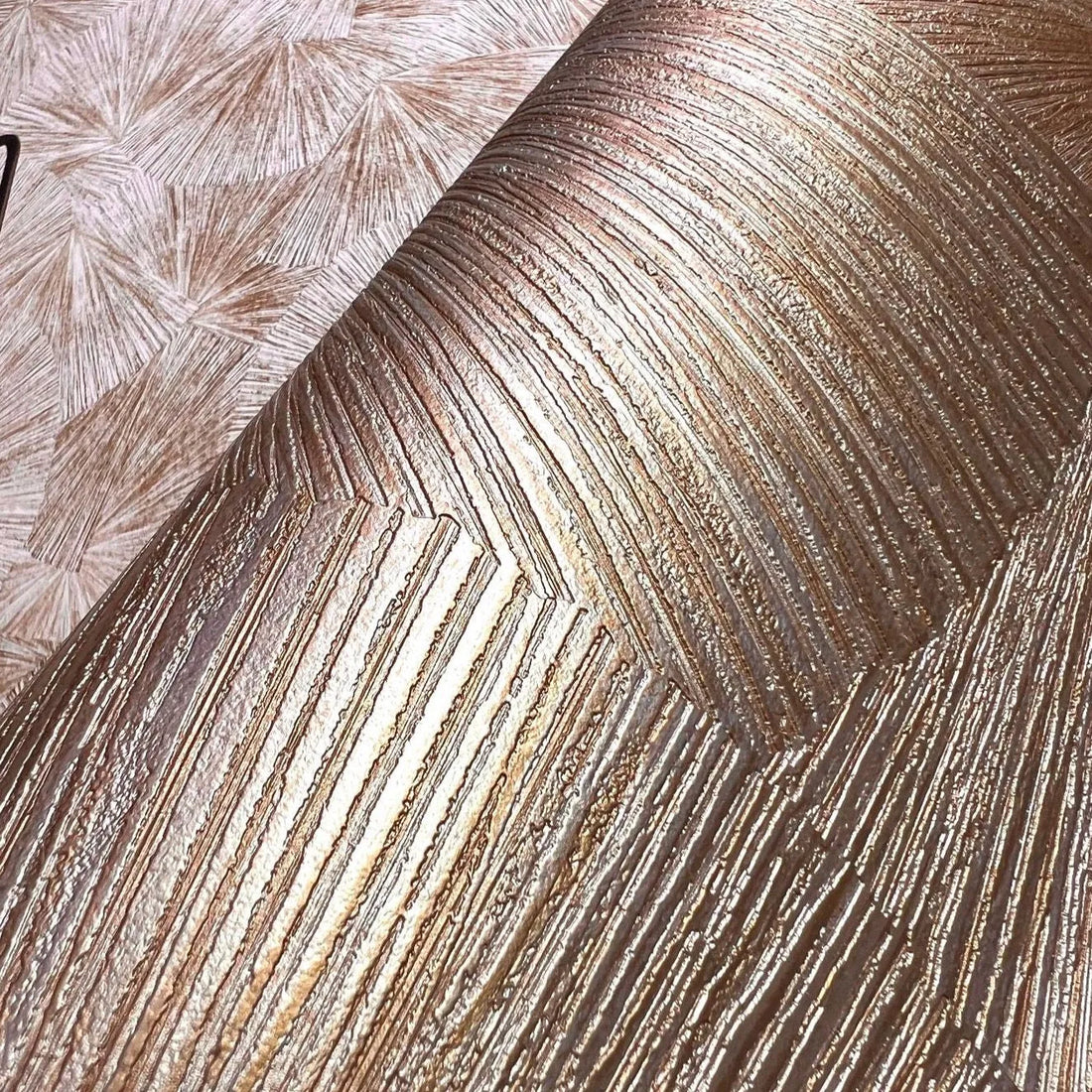 Closeup of a wallpaper showing its Contemporary, Embossed, Geometric, Gold, Textures pattern, color, and subtle texture.