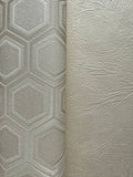 Two textured wall coverings side by side, one with geometric pattern and the other with a more organic surface.