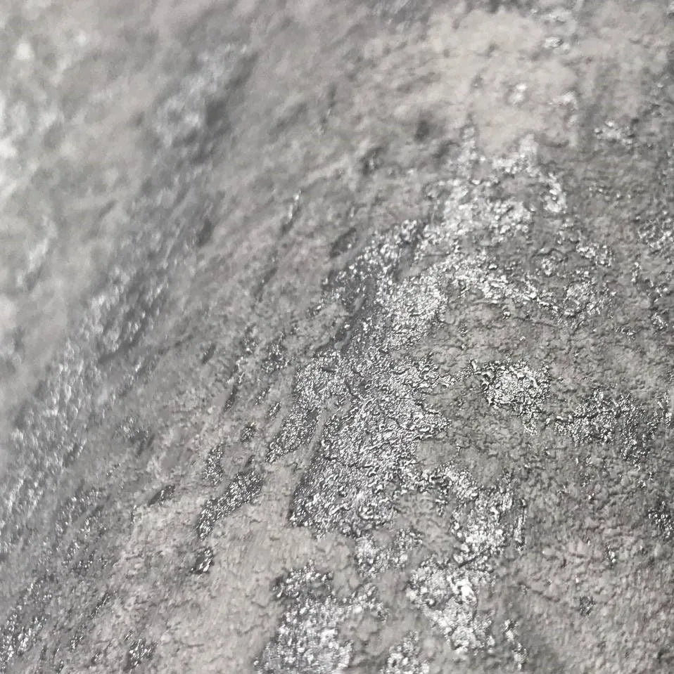 Closeup of a wallpaper showing its Concrete, Contemporary, Embossed, Grey, Metallic, Monochrome, Textures pattern, color, and subtle texture.