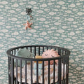 Wallpaper installed in a room showing its full pattern, color