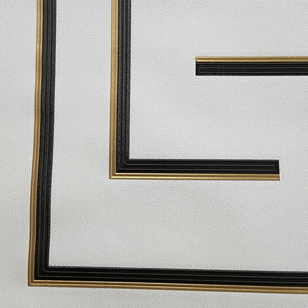Close-up of a black and gold wallpaper on a white background