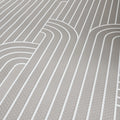 Close-up of a gray wallpaper with curved lines