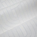 Close-up of a textured cream wallpaper