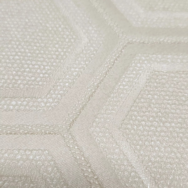 Close-up of textured cream wallpaper with a subtle pattern