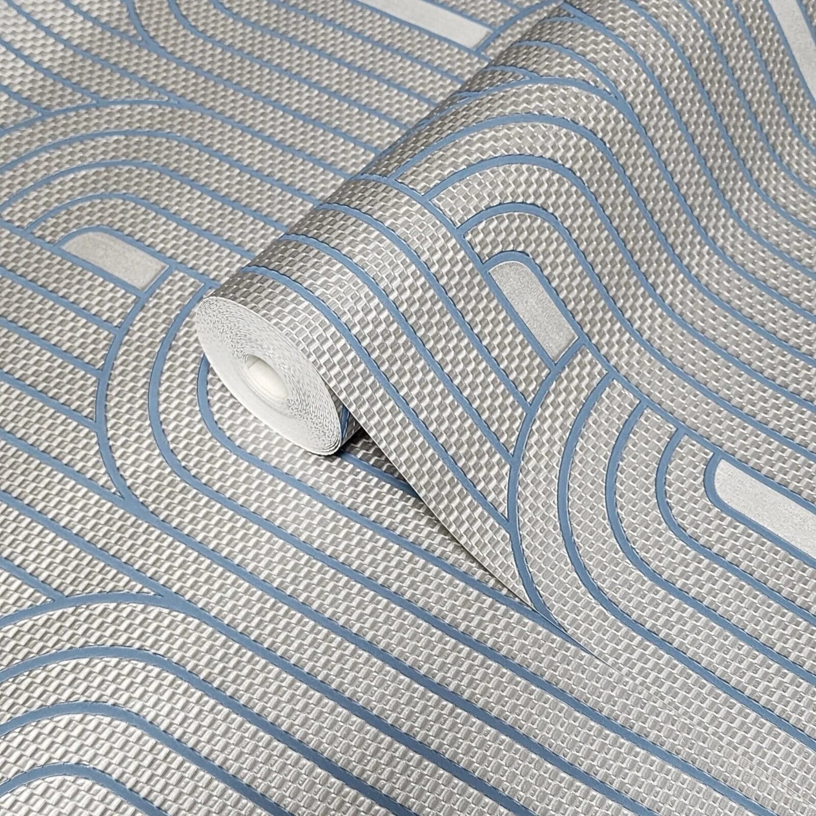 Roll of wallpaper with wavy blue lines on a gray background
