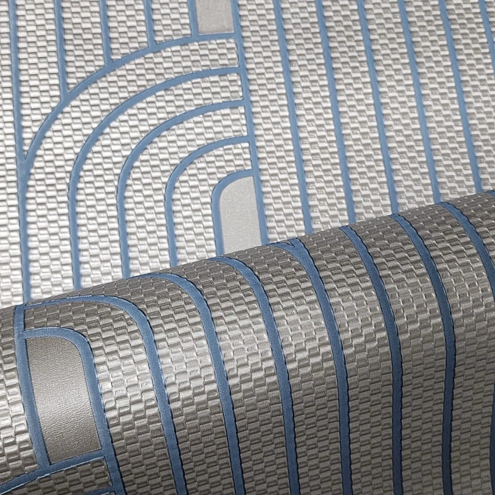 Close-up of a textured wallpaper with blue and gray pattern
