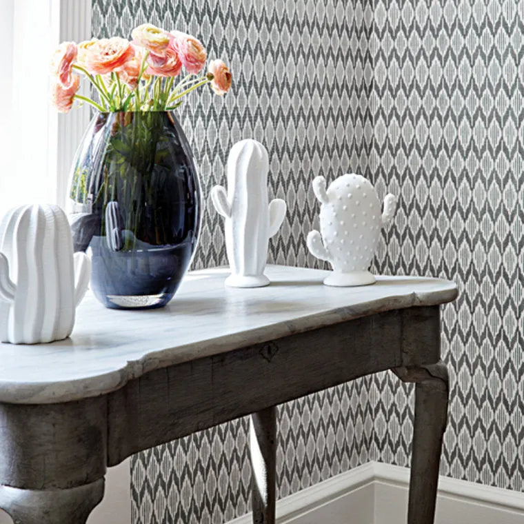 Closeup of a wallpaper showing its Chevron, Contemporary, Geometric, Neutrals, Two-tone pattern, color, and subtle texture.