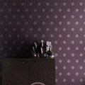 Wallpaper installed in a room showing its full pattern, color