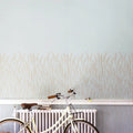 Wallpaper installed in a room showing its full pattern, color