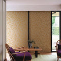 Wallpaper installed in a room showing its full pattern, color