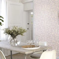 Wallpaper installed in a room showing its full pattern, color