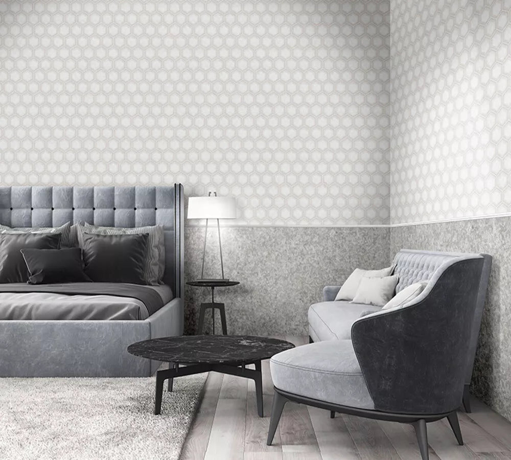 Modern bedroom with gray upholstered furniture and patterned wallpaper.