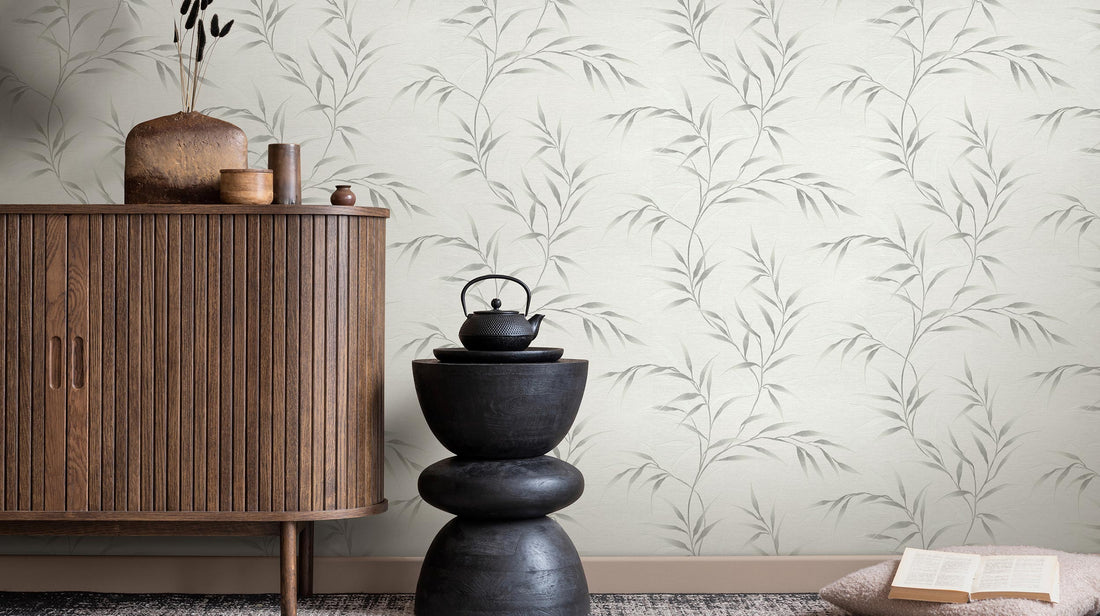 Decorative wallpaper with leaf pattern on a light gray background