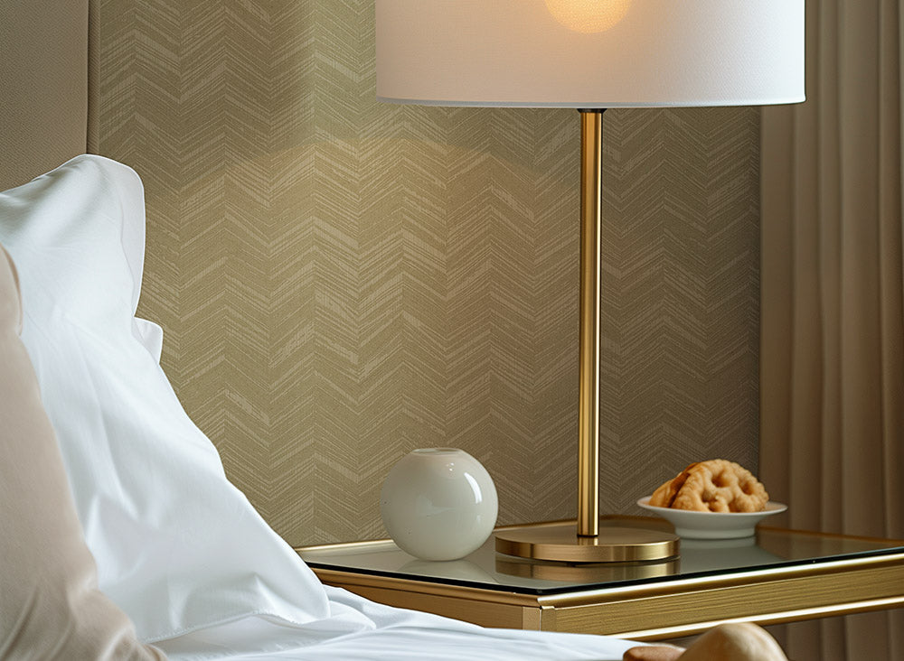 Textured beige wallpaper with a herringbone chevron pattern