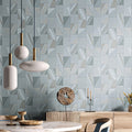 Geometric patterned wall tiles with decorative items in a room setting.