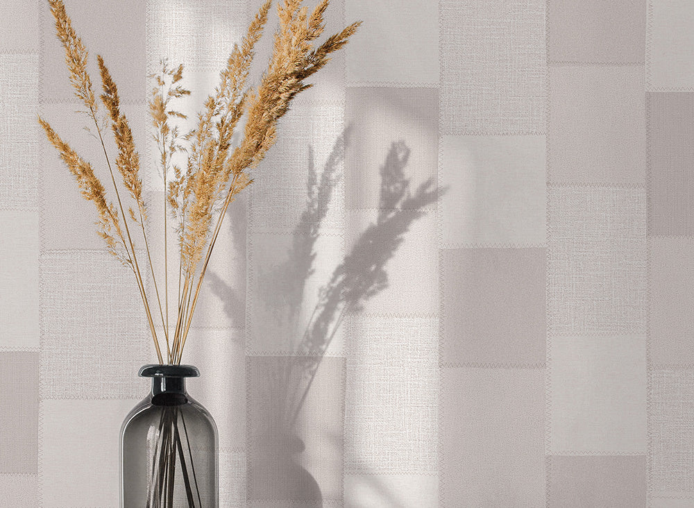 Patchwork of beige and yellow squares with a textured pattern
