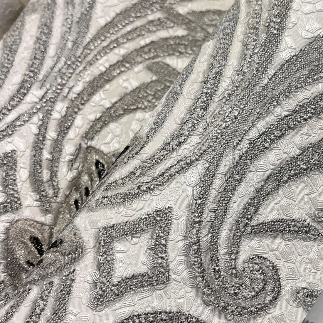 Closeup of a wallpaper showing its Damask, Luxury, Silver, Textures, Vinyl pattern, color, and subtle texture.