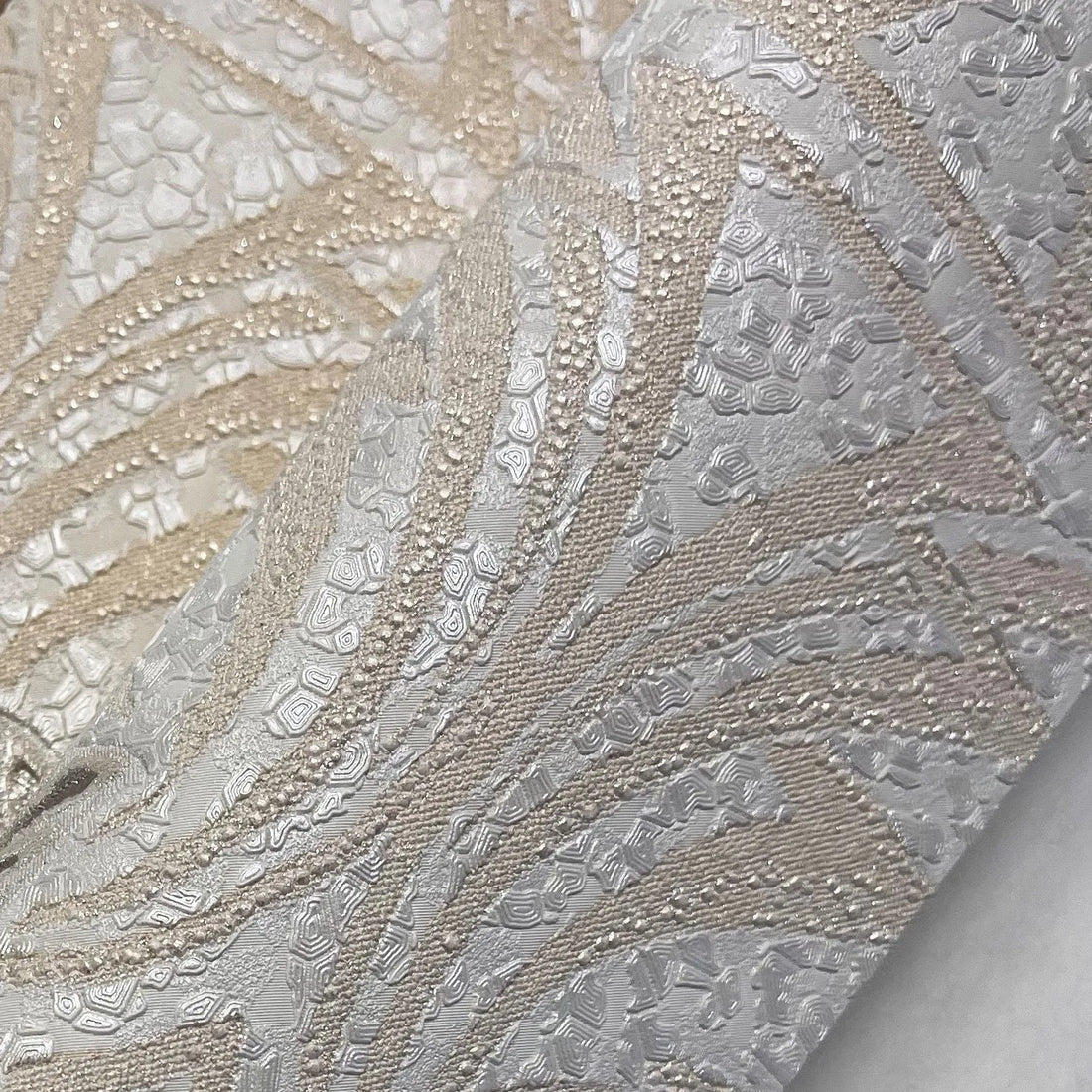 Closeup of a wallpaper showing its Damask, Luxury, Neutrals, Silver, Textures, Vinyl pattern, color, and subtle texture.