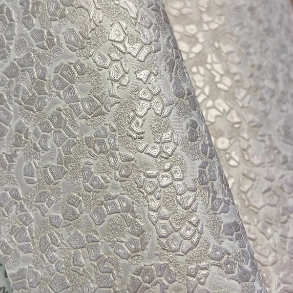 Wallpaper installed in a room showing its full pattern, color