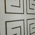 Decorative wallpaper with geometric patterns on a light gray background