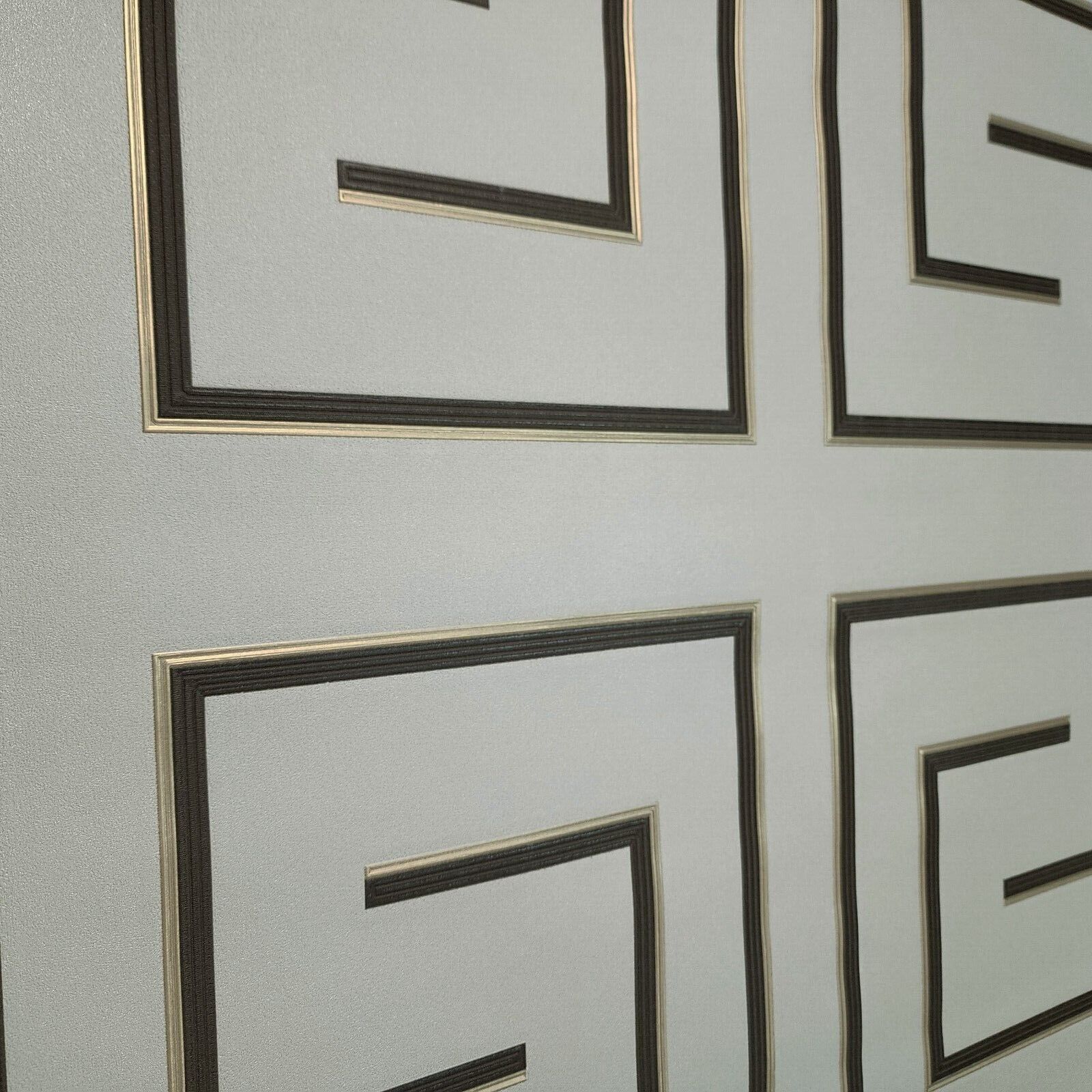 Decorative wallpaper with geometric patterns on a light gray background