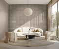 Modern living room with geometric wall pattern and white furniture