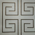 Decorative wallpaper with geometric patterns on a light gray background