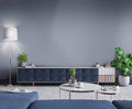 Modern living room with geometric wallpaper, blue sofa, and decorative elements.