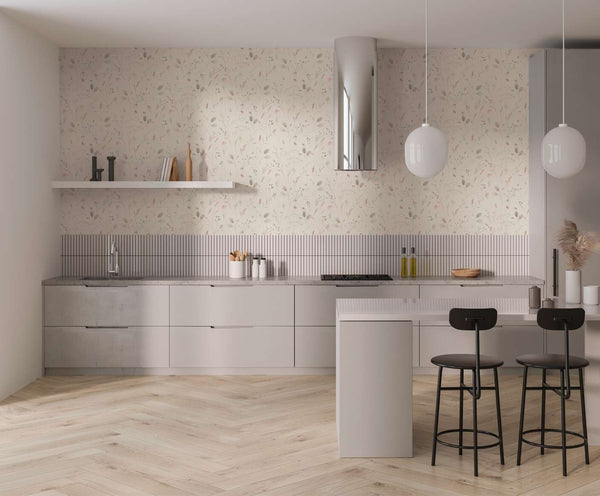 AS Creation Cosiness 792401 kitchen with Green, Grey, Pink floral wallpaper behind light cabinetry and an island.