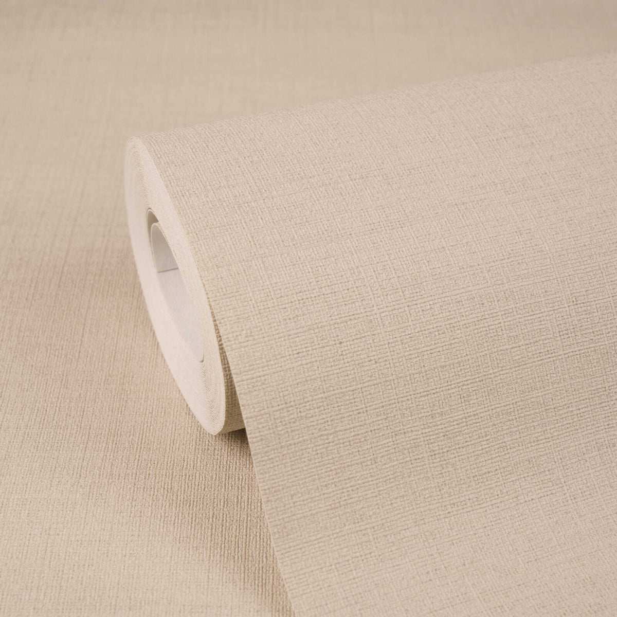 AS Creation Cosiness 792435 beige and Brown textured crosshatch wallpaper roll resting on a matching unrolled sheet.