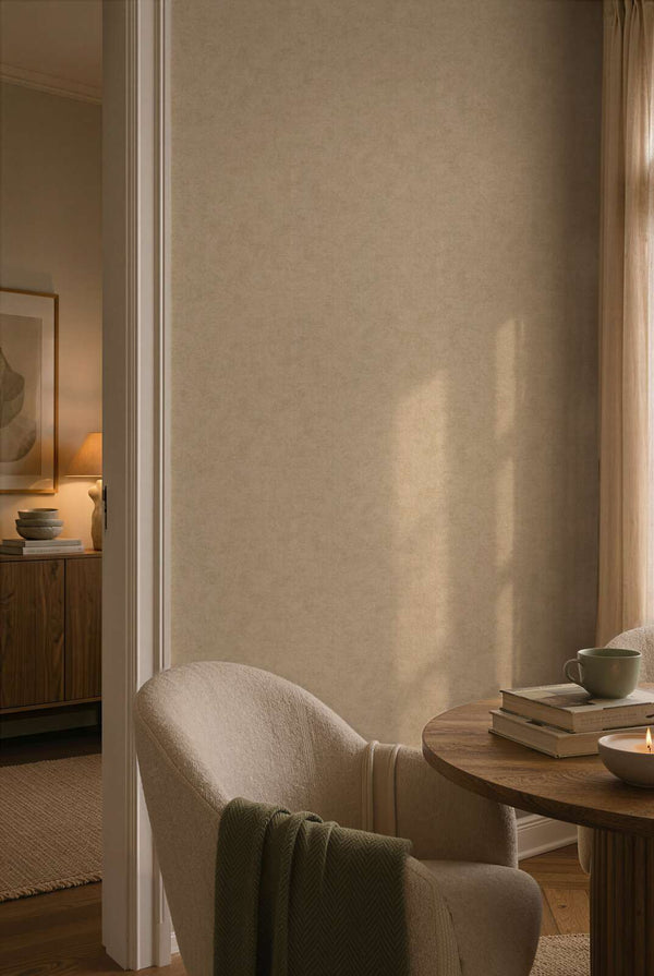 AS Creation Cosiness 792841 living room with tonal mottled wallpaper, a round table and an upholstered armchair.