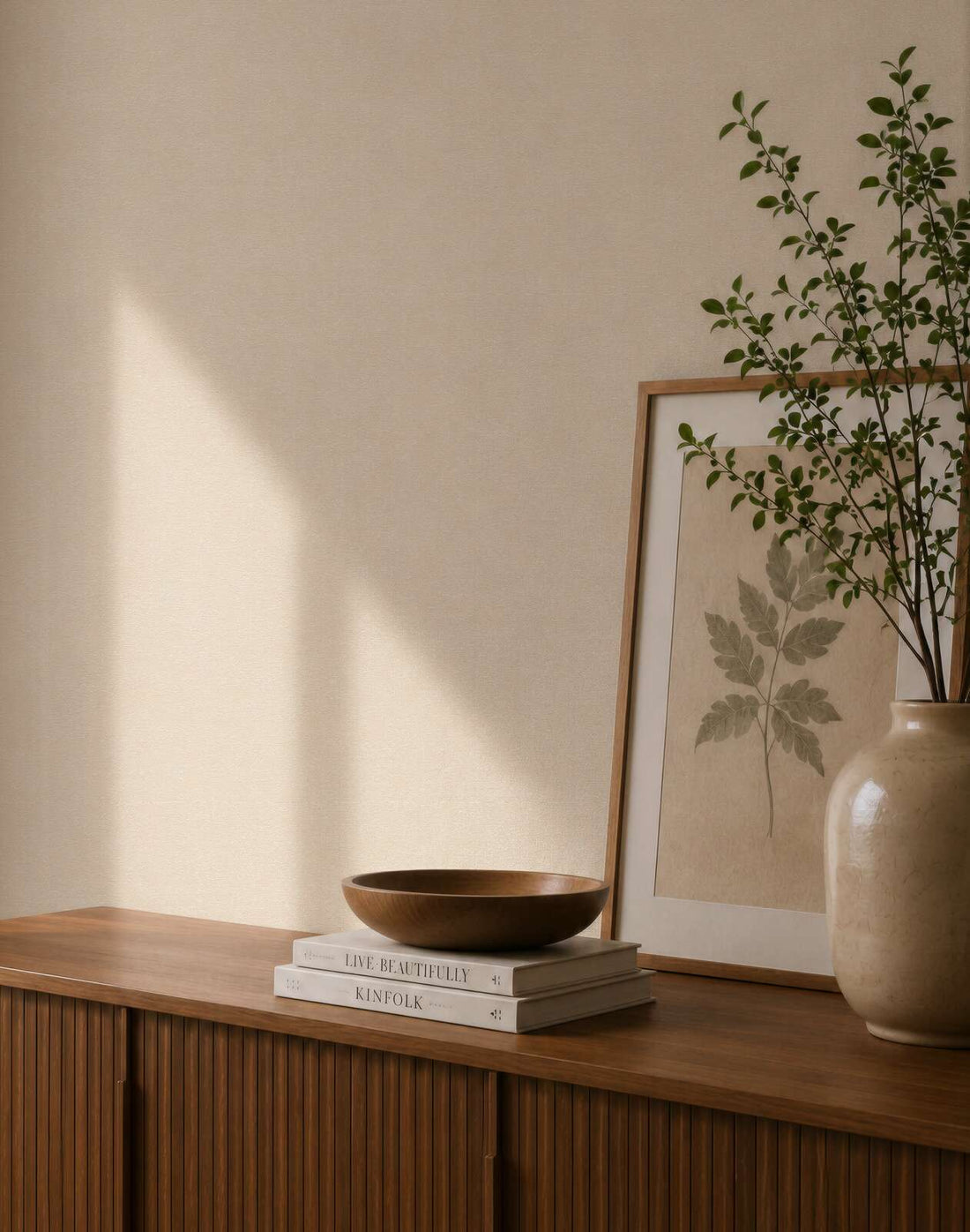 AS Creation Cosiness 792843 neutral plain wallpaper with a subtle tonal texture in beige and cream shown in a styled detail.