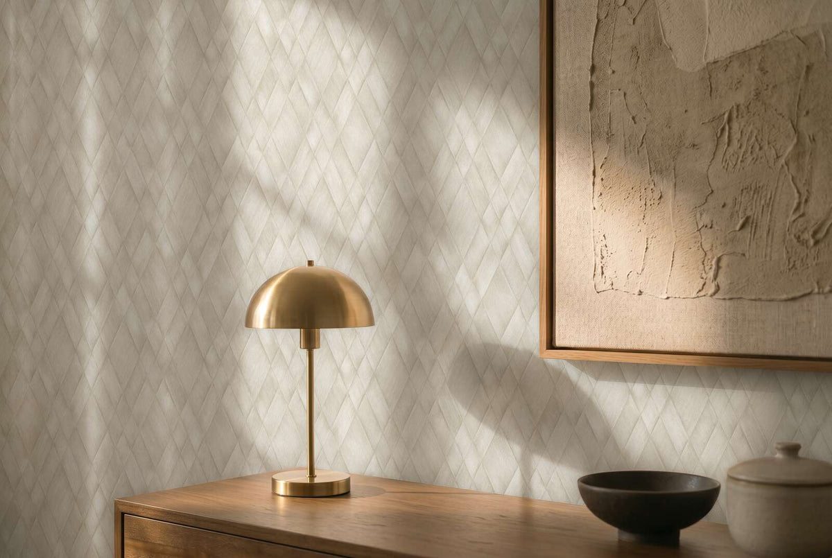 AS Creation Cosiness 793132 grey, White geometric diamond pattern wallpaper behind a wood console with a brass dome table lamp and a framed artwork.