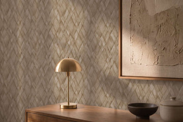AS Creation Cosiness 793134 brown geometric diamond wallpaper behind a wooden cabinet with a brass dome lamp and framed artwork; a bowl and lidded jar sit on the surface.