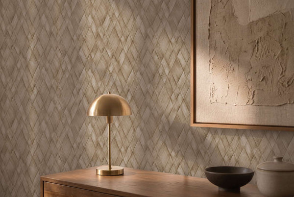 AS Creation Cosiness 793134 brown geometric diamond wallpaper behind a wooden cabinet with a brass dome lamp and framed artwork; a bowl and lidded jar sit on the surface.