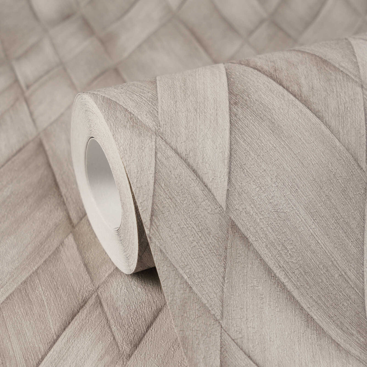 AS Creation Cosiness 793135 wallpaper roll resting on matching surface, showing a geometric layered diamond pattern with a woodgrain effect in Brown, Grey.