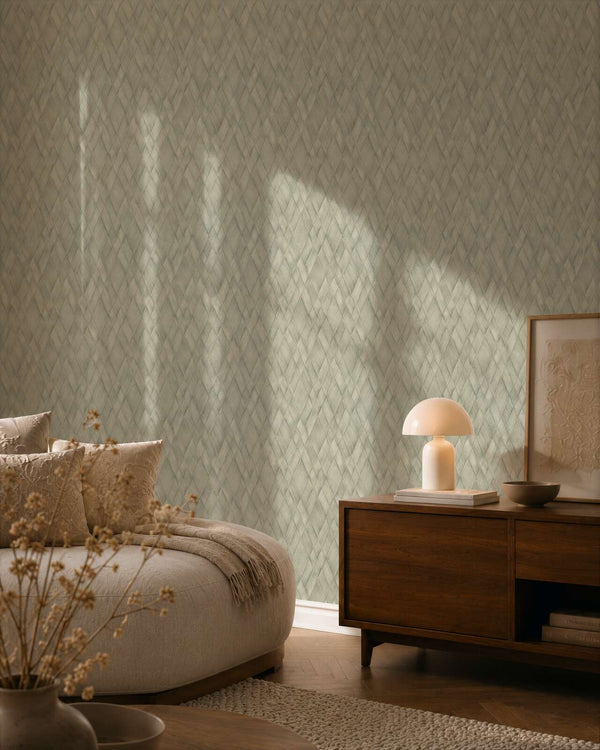 AS Creation Cosiness 793136 bedroom with Green geometric diamond wallpaper, shown with a wooden sideboard and part of a bed.