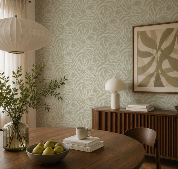 AS Creation Cosiness 793142 dining room with Green leafy wallpaper, a round wooden table and a sideboard.
