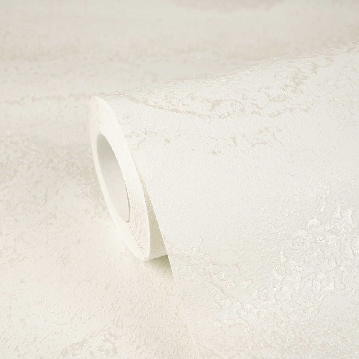 AS Creation Cosiness 793164 close up of a wallpaper roll resting on matching unrolled paper in Metallic, White.